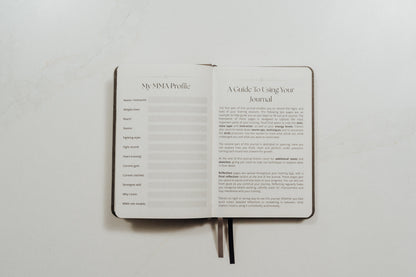 Open MMA training journal showing guided pages on a white background