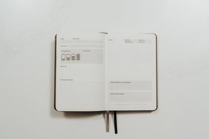 The MMA Journal open to show its guided training prompts on a white background