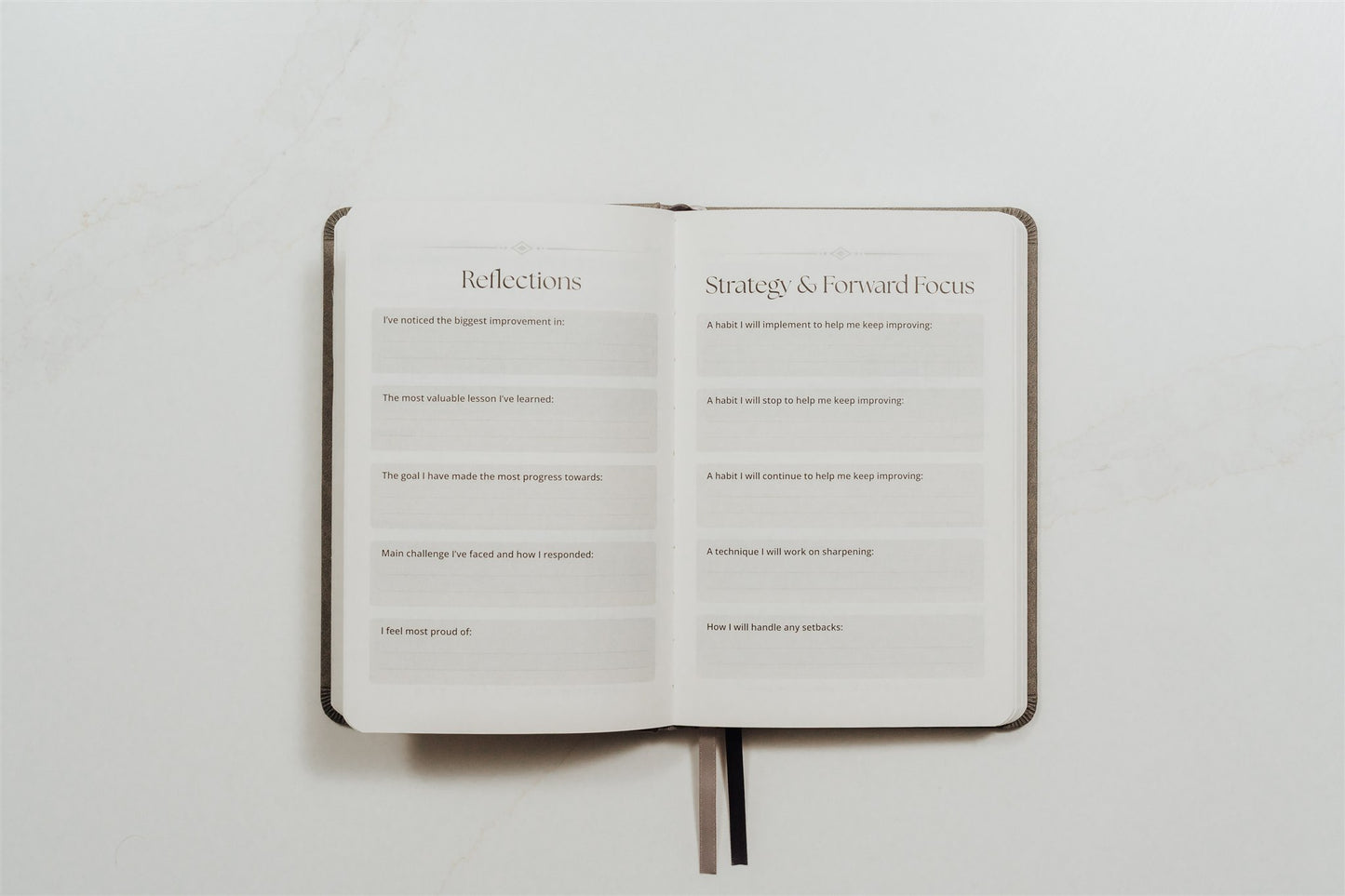 Open MMA training journal showing printed text prompts on a white background