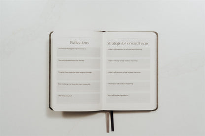 Open MMA training journal showing printed text prompts on a white background