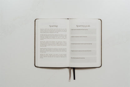 The MMA Journal lying open on a white background