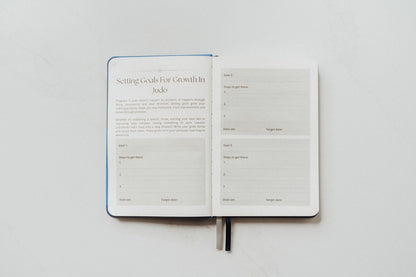 The Judo Journal open to its goal-setting pages on a white background