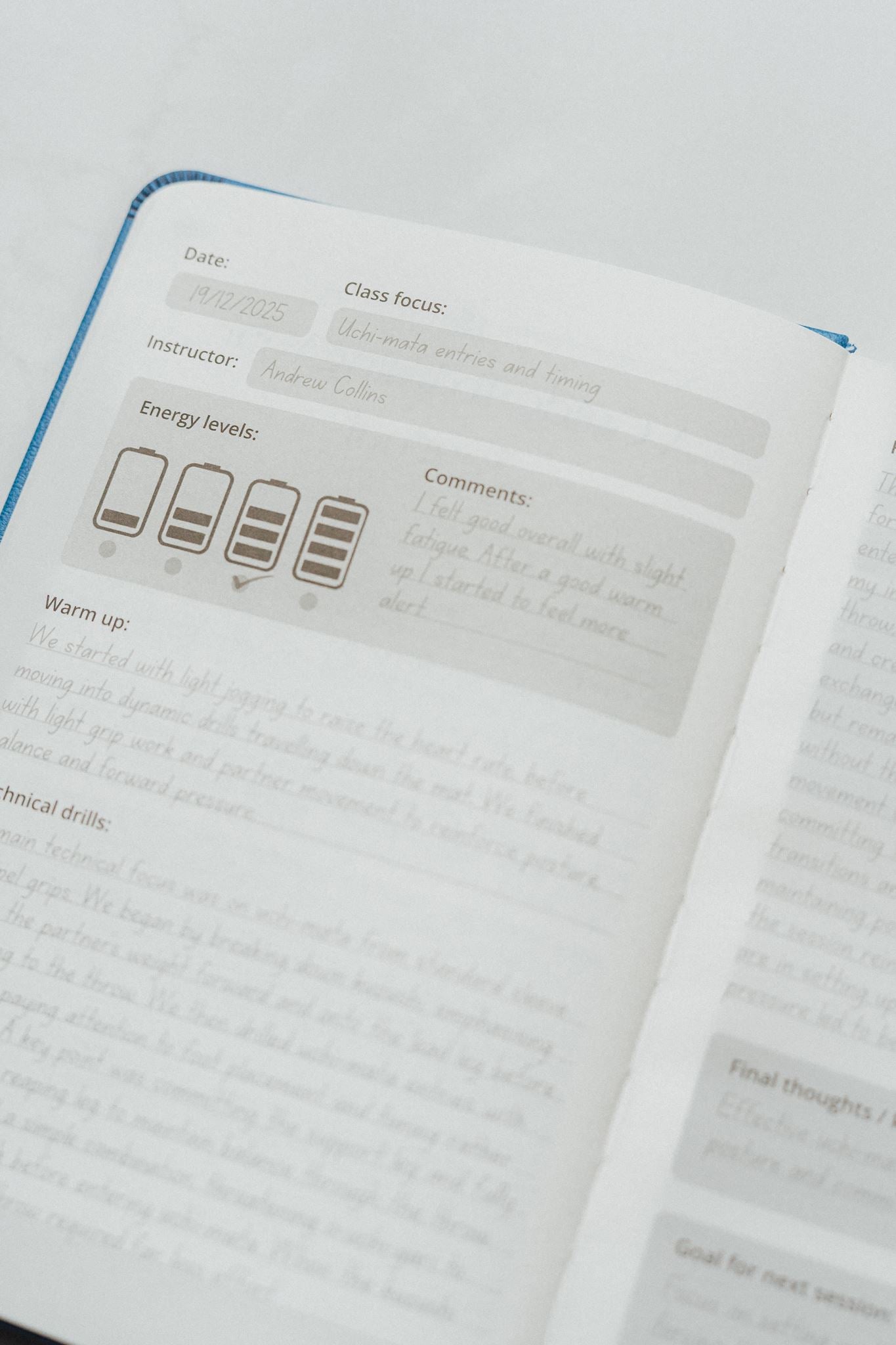 The Judo Journal open to an example page on a white background