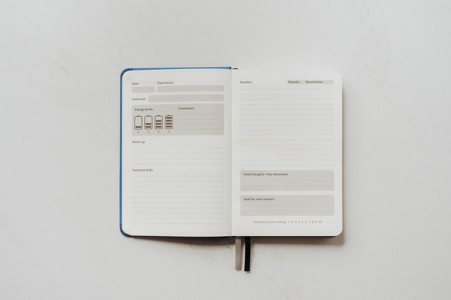 The Judo Journal open to show its guided prompt pages on a white background