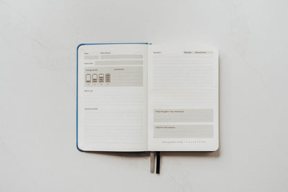 The Judo Journal open to show its guided prompt pages on a white background