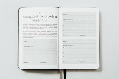 open planner showing the inside pages for setting goals in martial arts